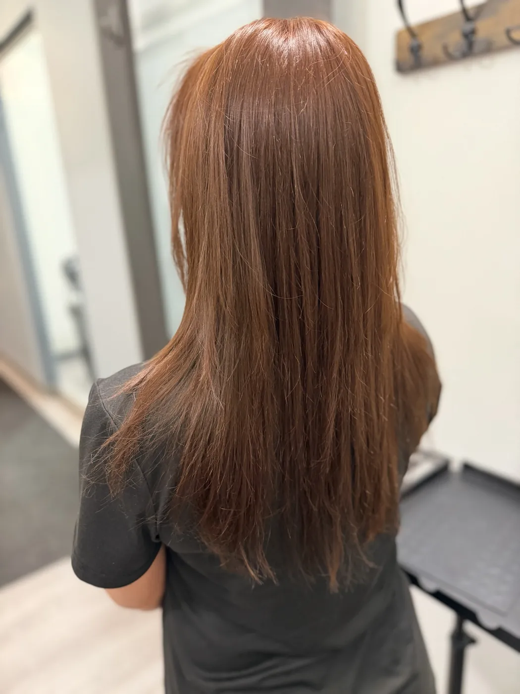 Sleek, frizz-free auburn lengths after a smoothing treatment