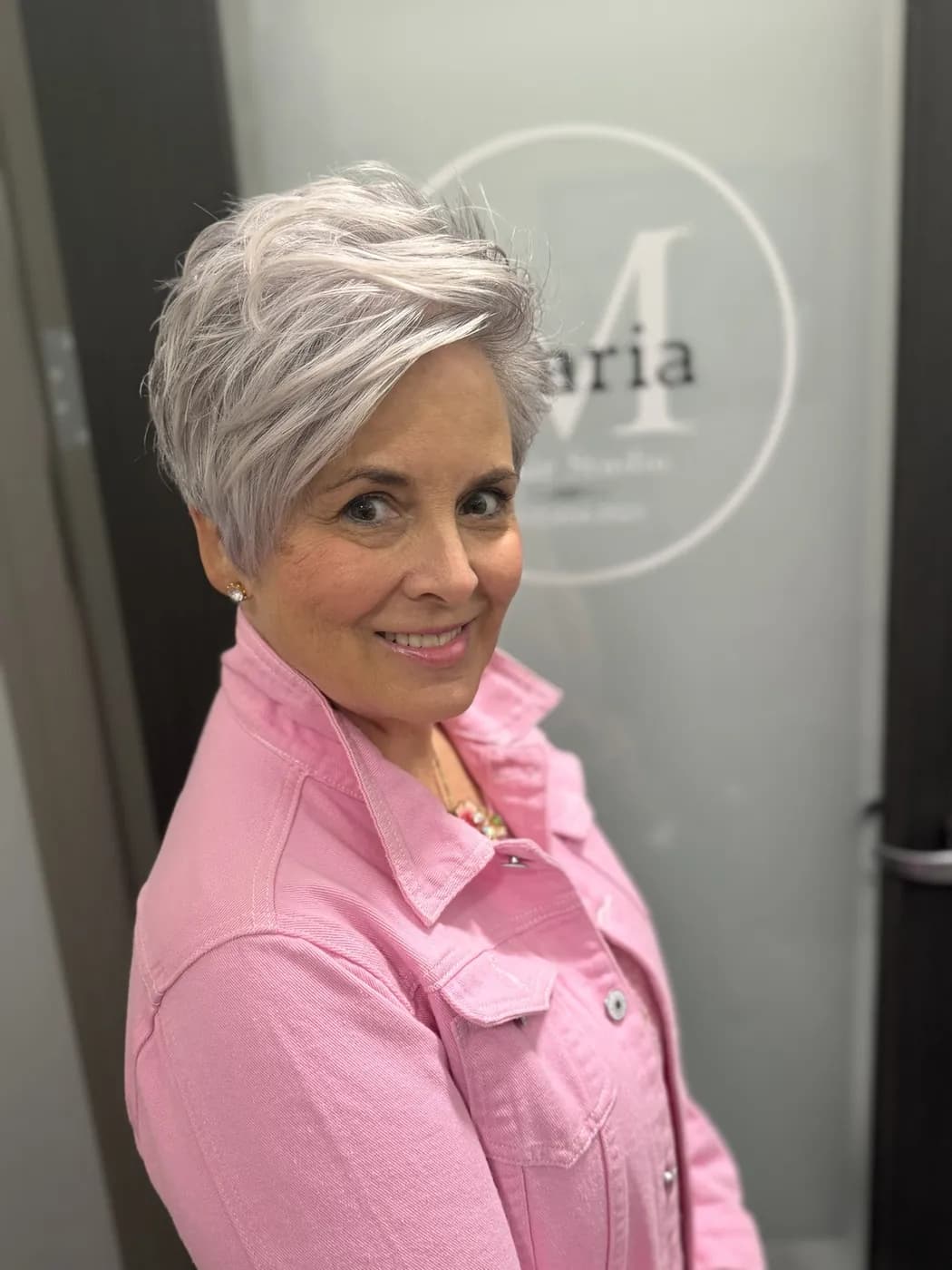 A soft silver pixie, cut close and styled with movement