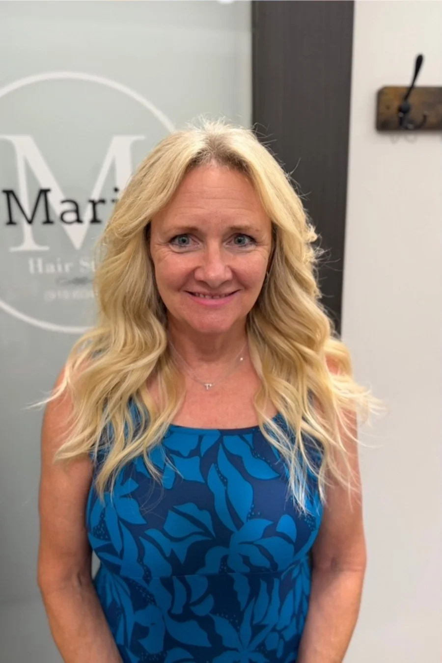 Long, full blonde waves after a sewn-in weft install